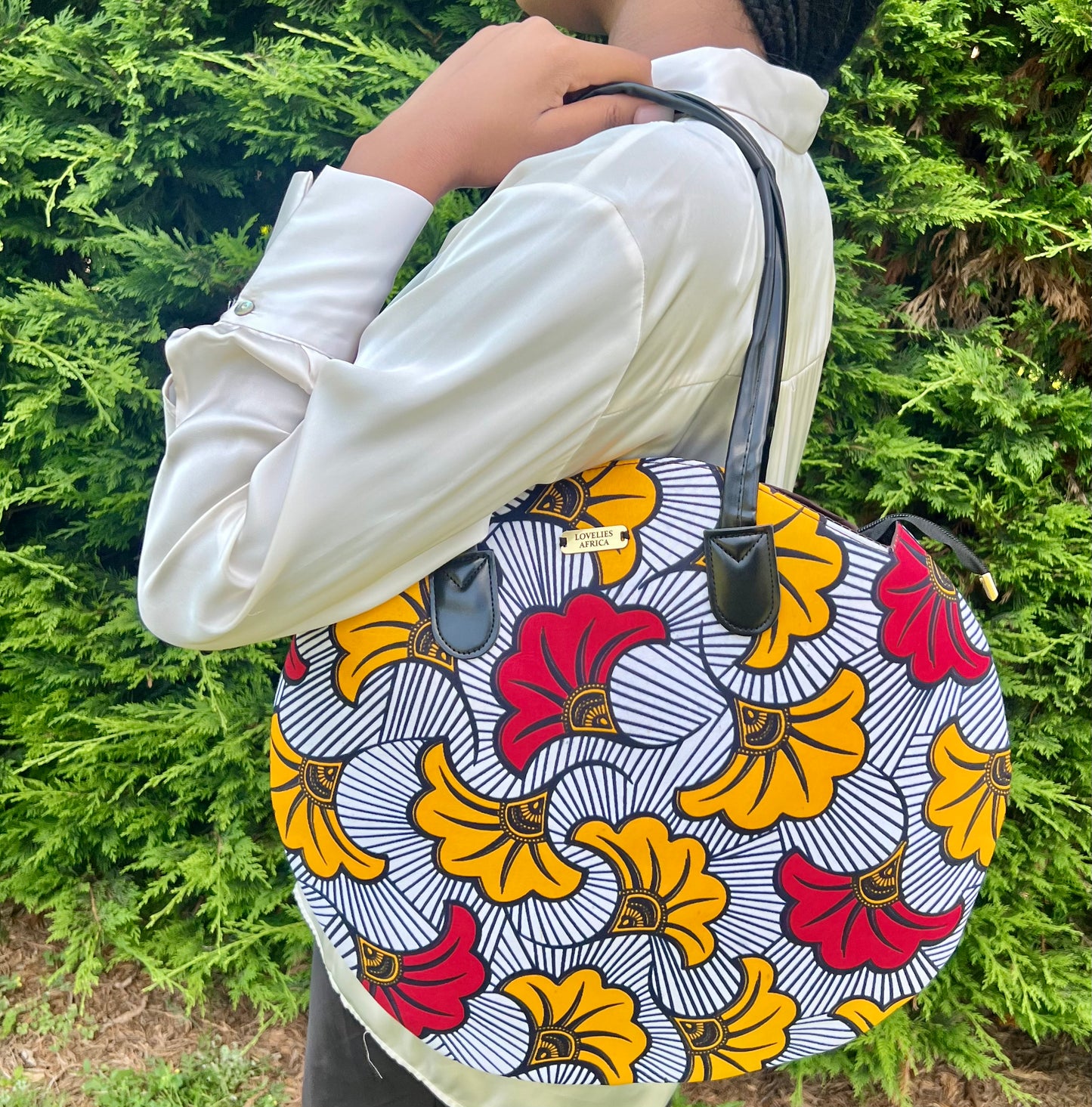 Round tote bag in mixed orange and red wax