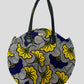 Round tote bag in mixed purple and yellow wax